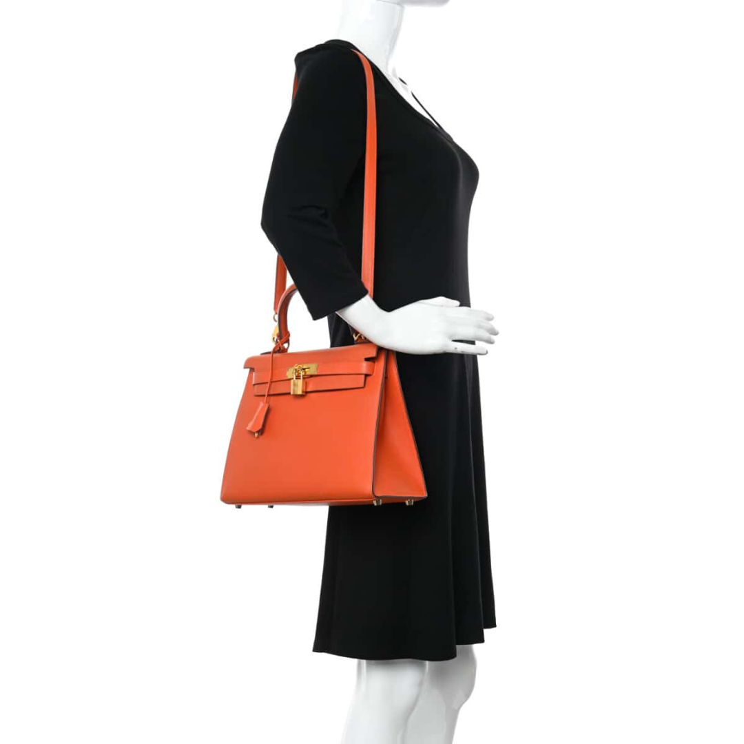 HERMÈS KELLY 25 BAG WITH GOLD HARDWARE IN ORANGE
